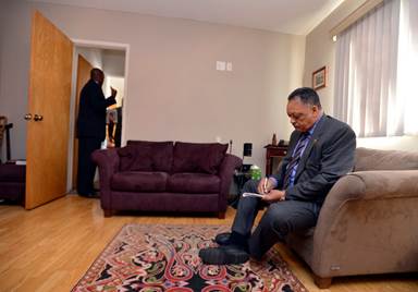 Civil rights leader Rev. Jesse Jackson writes down notes in an upstairs office before his speech at Bethlehem Missionary Baptist Church in Richmond, Calif., on Sunday, Jan. 25, 2015. (Susan Tripp Pollard/Bay Area News Group)